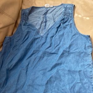 Blue denim like gap top, not exactly denim. Super cute size women’s small